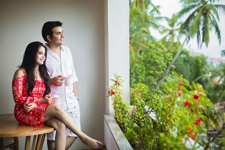 Honeymoon couple enjoying a cozy stay at Munnar tea plantation
